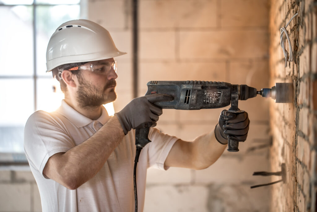 handyman uses jackhammer installation